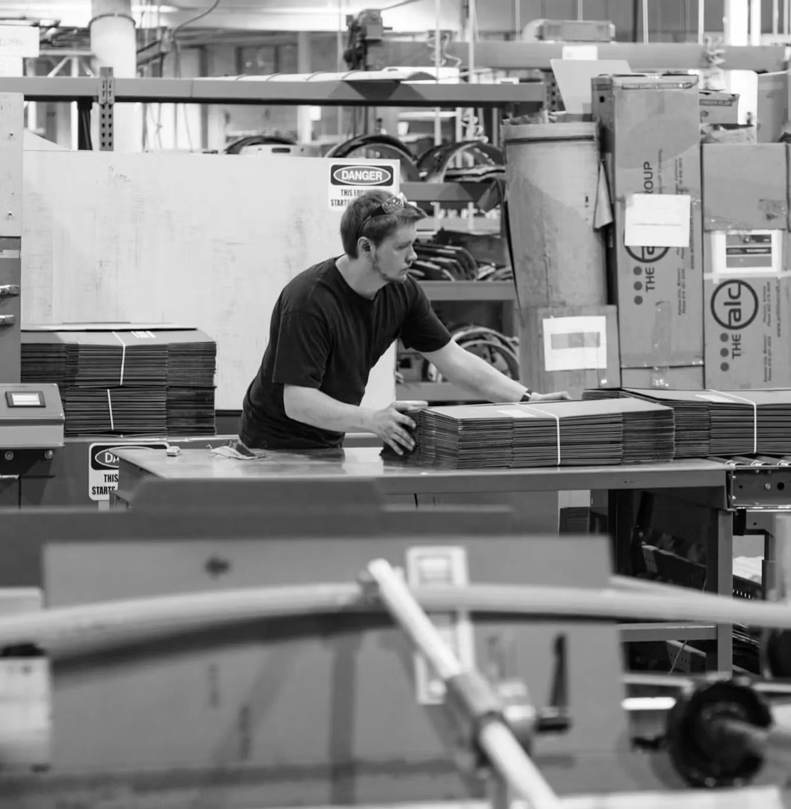 A craftsperson working in a shop.